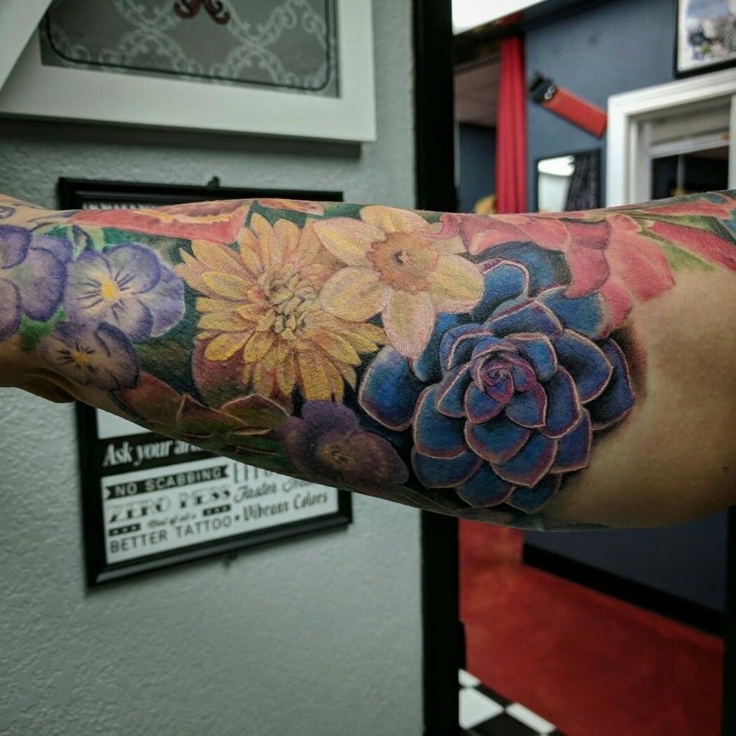 Full color flowers tattoo by Damon Conklin TattooNOW