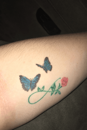 The butterflies added ontop of my first ink in rememberance of my grandparents. Needs a little bit of a touch up, recently healed. 
