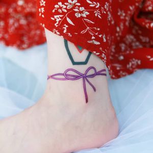 A purple butterfly knotted bracelet around the ankleby SION (@tattooistsion) #flowertattoo #floraltattoo #Korea #KoreanArtist #tattooistsion #colortattoo #flower #flowers #oriental 