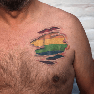 Gay flag done on Rudy who needed to show this badly. Its his first tattoo and sat like a rock.