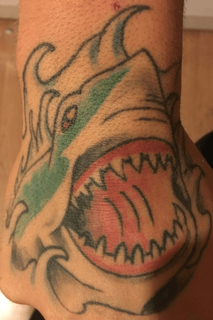 Hand tattoo of shark