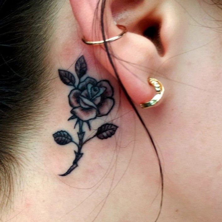 Tiny black rose tattoo behind the ear  Tattoogridnet