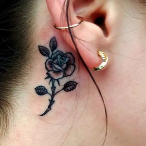 Simple rose tattoo behind ear