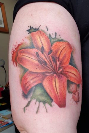 A gorgeous lady did this beautiful Tiger Lily on my arm in a water colour style. Absoultely love it