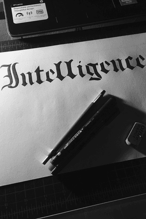 Old English style lettering of the word “Intelligence” using a mono pen and a lead pencil. I’m starting to dig this style because it looks very mideval and it makes the lettering look more dark age but I’m pretty sure that there are way better designs out there.