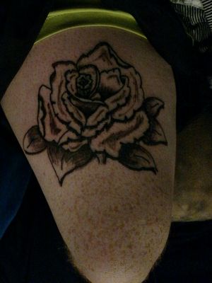Thigh rose tattoo