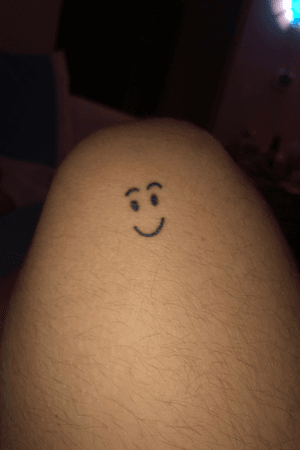 A smile face tattoo
