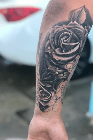 realistic roses to fill gaps in a clients arm