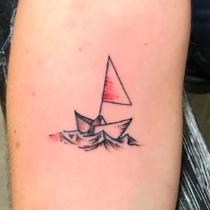 Small paper sailboat tattoo #lineworktattoo #sailboat #paperboat #oragami #cutetattoos #smalltattoos #girlytattoos 