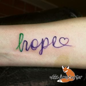 "hope" with a ribbon from March 2018. http://nikkifirestarter.com #tattoos #bodyart #bodymods #hope #hopetattoos #colortattoos #typography #texttattoos #graphictattoos #brushstroketattoos #brushstrokewords #inspirationaltattoos #forearmtattoos #wristtattoos #smalltattoos #cursive #cursivefont #cursivetattoos