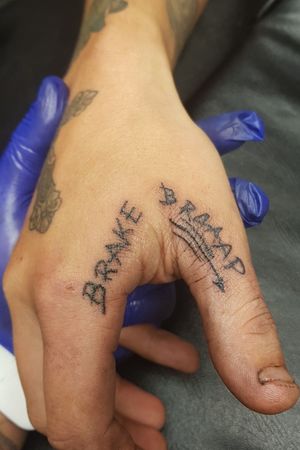 Finger & thumb tattoo 