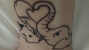 Best friend tattoo of a fox and elephant making a heart