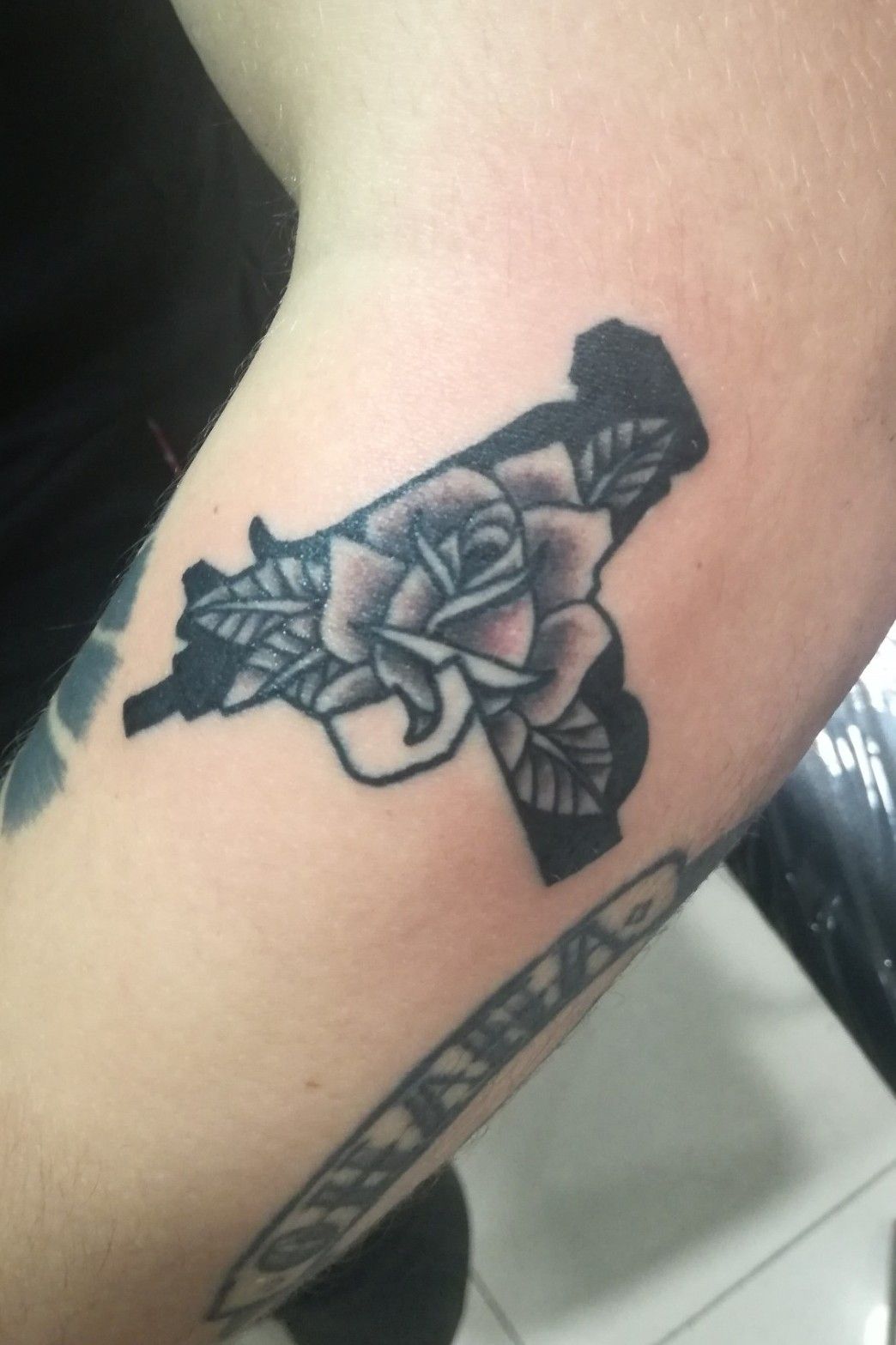 Tattoo uploaded by Mr. Jojomachine • Uzi with rose #traditionaltattoo  #blacktattoo #rosestattoo #guntattoo • Tattoodo