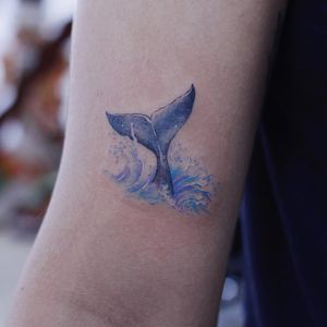 Tattoo by Saegeem #Saegeem #oceanlifetattoos #oceanlife #ocean #nature #wildlife #animal #water #whale #whaletail #splash #watercolor #color #realism #realistic #painterly