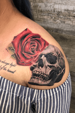 Half fresh, half healed. Fun skull and rose tattoo!