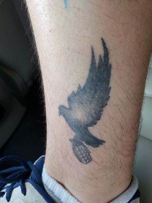 My first tattoo from new years eve 2014. Hollywood undead dove and grenade.