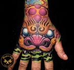 Awesome colour foo dog hand tatt