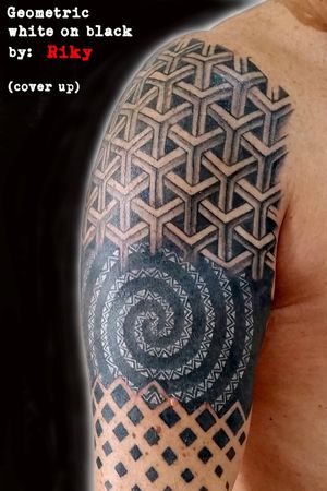 Cover Up of an old tattoo with a geometric project and white on black lines