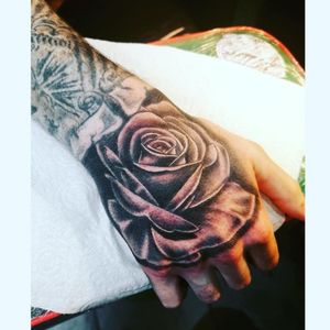 Black and White rose on hand. 