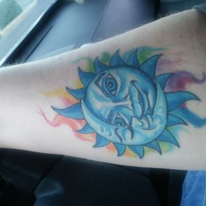 Moon and sun tattoo with chakra flames