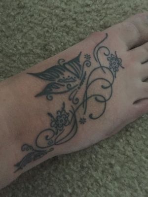 Butterfly foot tattoo