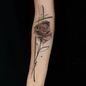 Elegant tattoo design featuring a beautiful flower and intricate pattern on the forearm by La Bottega dell'Arte.