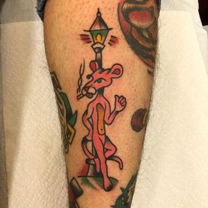 Tattoo by Jeff Sypherd #JeffSypherd #tvshowtattoo #tvshow #tvtattoo #PinkPanther #color #traditional #cat #lamppost #cigarette