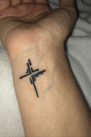 A cross done by Hannah Pearl at Springfield Ink