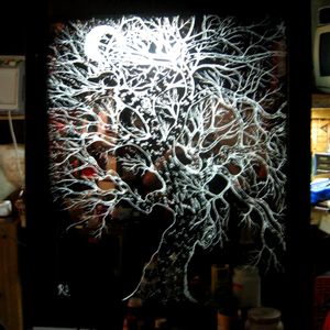 4' by 4' mirror with frame....I designed a tree on reverse side, then etched out my sketch with a dremel and diamond tip bits added lighting and walla!