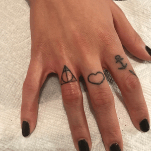 Deathly hallows finger tattoo 