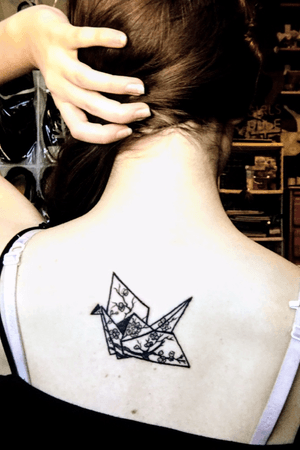 This is the first tattoo I got. It's a tribute to a close friend of mine who passed away years ago. It's my little reminder to spread her legacy. 🧡 #papercrane #origami #memorialtattoo 