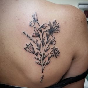 Fine line wild flower tattoo