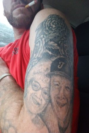 So guys yes this is a cover up tattoo I had done in prison'not proud of prison' but that's my GMA and GPA on there 25th anniversary it took 8 hours with a CD player motor and single Needle dude is a hell of a artist