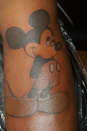 Mickey mouse cartoon character arm tattoo 