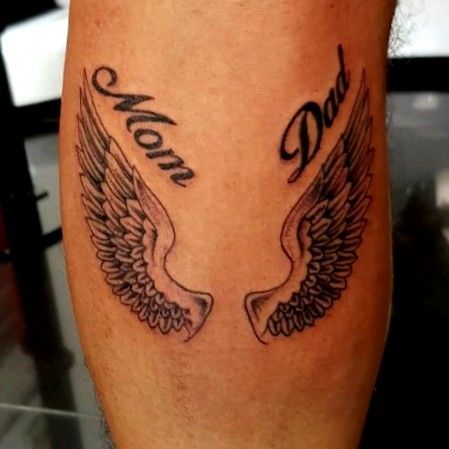 Grey Ink Winged Heart And Mom Dad Tattoo