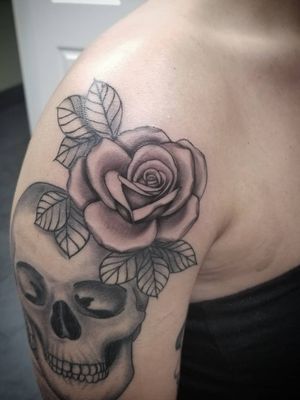 Progress on this black and grey skull and rose half sleeve