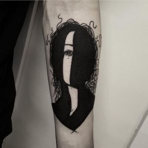 Silhouette of a women, left forearm, now has patterns around and integrated into the sleeve. 