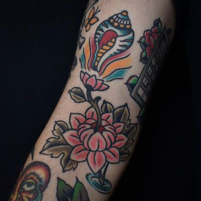 Tattoo by Tony Trustworthy #TonyTrustworthy #Buddhisttattoos #Buddhist #Buddha #meditation #mindfulness #peace #love #compassion #conch #shell #seashell #lotus #flower #floral #stairway #color #traditional