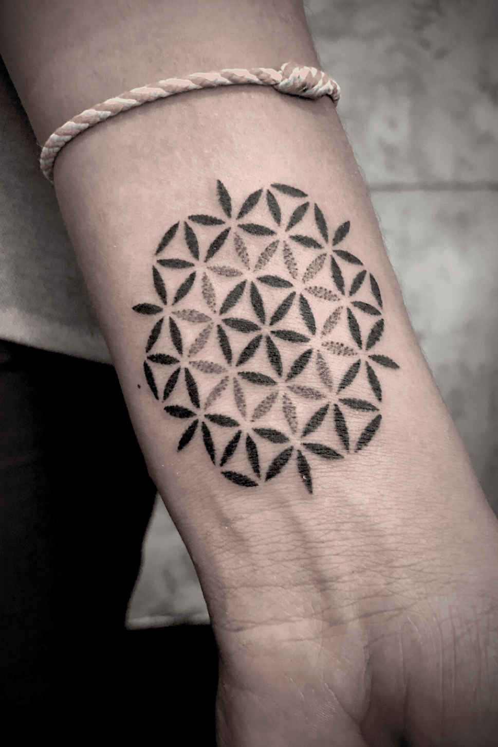 Flower of life tattoo on the inner forearm