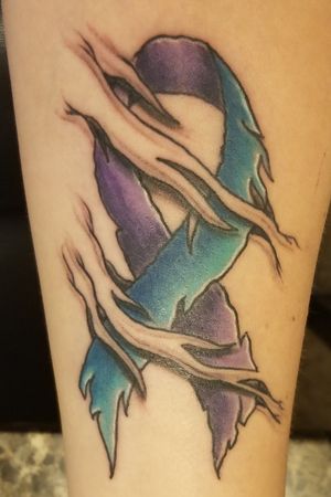 First tattoo done by Bre at Vicious Ink. Blue=survivor of child abuse/sexual assault and Purple=survivor of domestic violence 