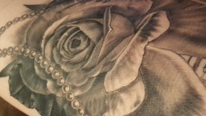 Detail shot of the first session of my side piece by @jorgelopez.ink check his work out on Instagram. #realism #blackandgreytattoo #rose #pearls #firstsession #thigh #booty 