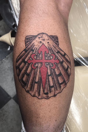 Seashell tattoo with cross 