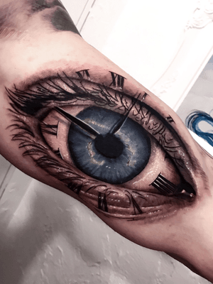 Time is just a reflection of the past. Eye tattoo