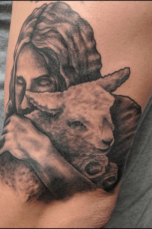 Jesus holding a lamb.