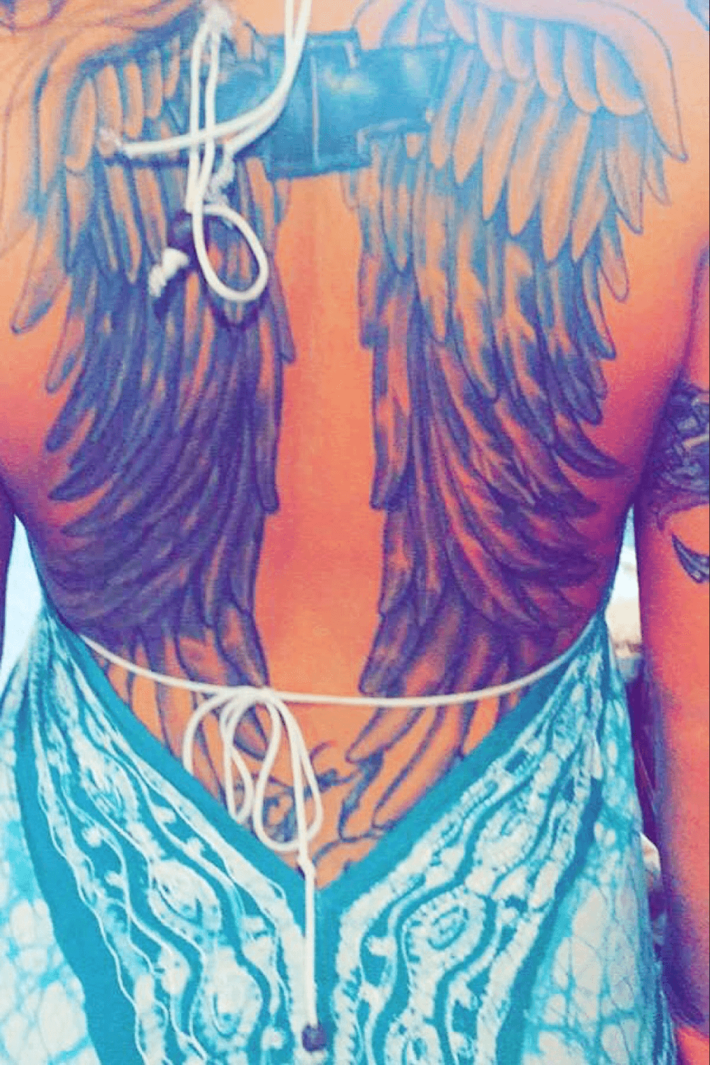 purple wings tattoo