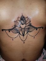 Under breast design tattoo 