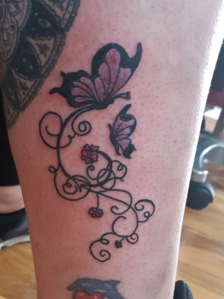 Tattoo uploaded by Oscar Jack's Tattoo Parlour • Nice bit of girly swirls  here with a butterfly, she was really happy with this :) #girlytattoo # swirls #butterflytattoo #colourtattoo • Tattoodo