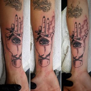 Hand with blunt ** not my original artwork but I added some things and changed quite a bit of it #handtattoo #tattoo #armtattoo #blackandgreytattoo #eyetattoo #blunt #smoketattoo 