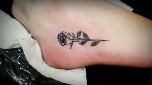 Small linework rose on a foot#foottattoo #tattoo #lineworktattoo #rosestattoo 