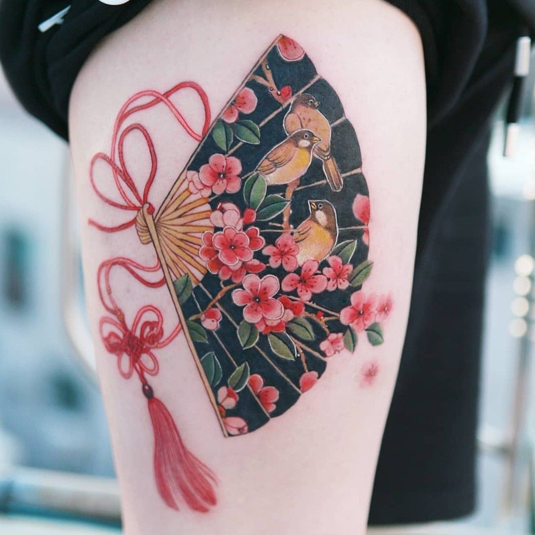 Tattoo uploaded by SION • Cherry blossoms and a sparrow drawn in a fan with  a red butterfly knot. #tattooistsion #flowertattoo #floraltattoo #Korea  #KoreanArtist #tattooistsion #colortattoo #flower #flowers #oriental •  Tattoodo